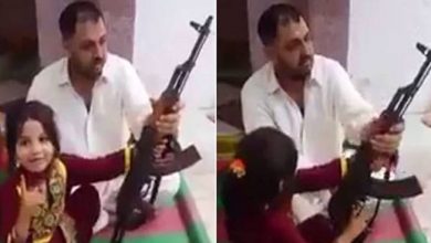 Pakistani father makes little girl fire AK-47