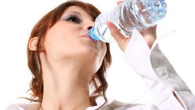 woman-drinking-water-from-a-bottle