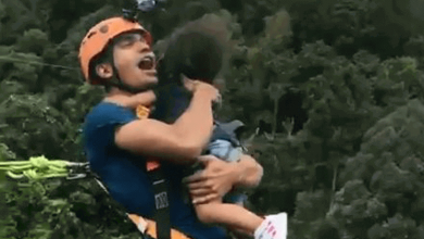 dad-holds-toddler-while-bungee-jumping