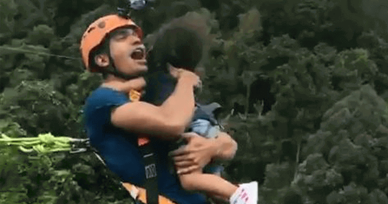 dad-holds-toddler-while-bungee-jumping